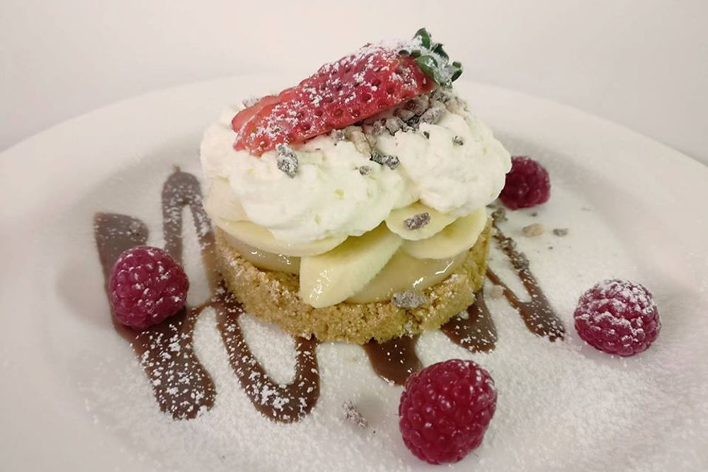 Dessert with cream, strawberries and raspberries