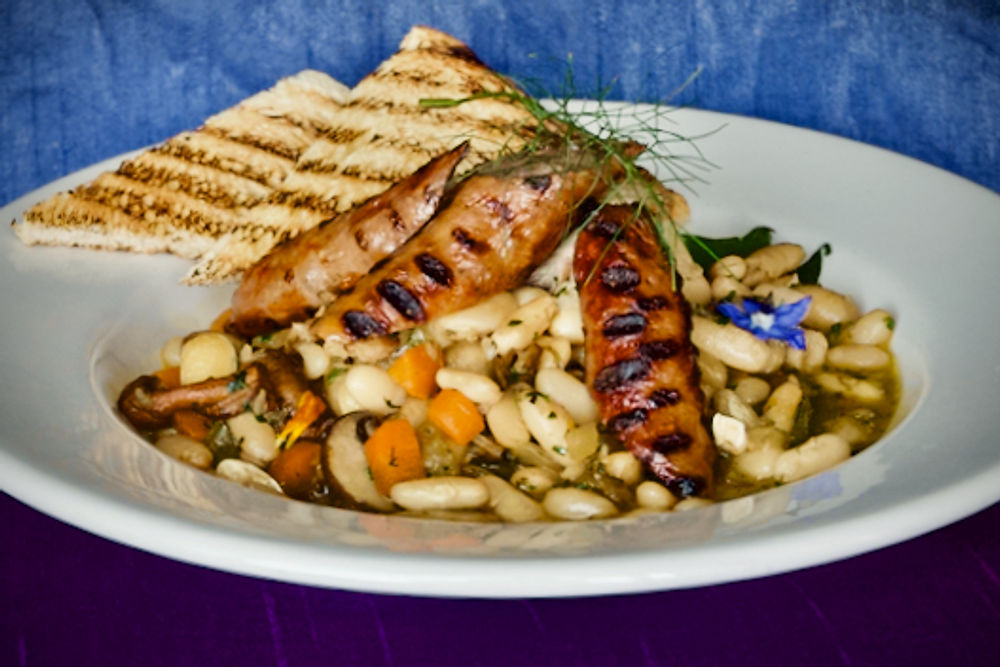 Grilled sausages with white beans and toasted sourdough